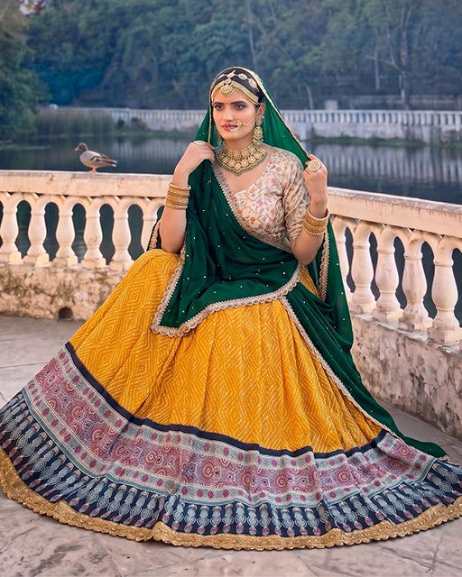 Royal Marwadi Yellow Color Bandhani And Ajarakh Print Lehenga Set