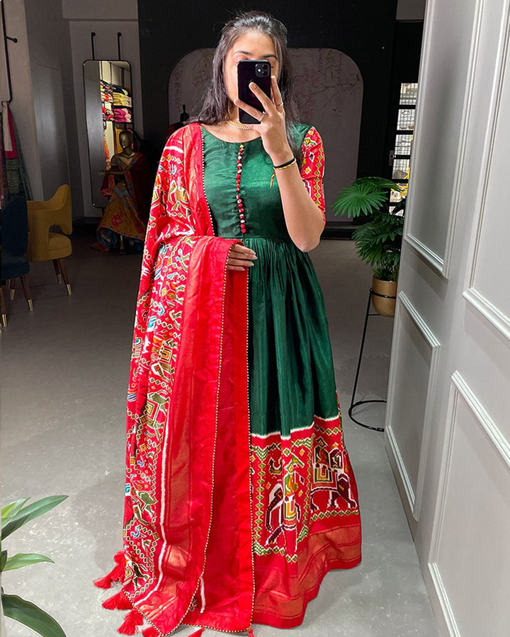Green Color Patola Printed Dola Silk Fully Flair Gown