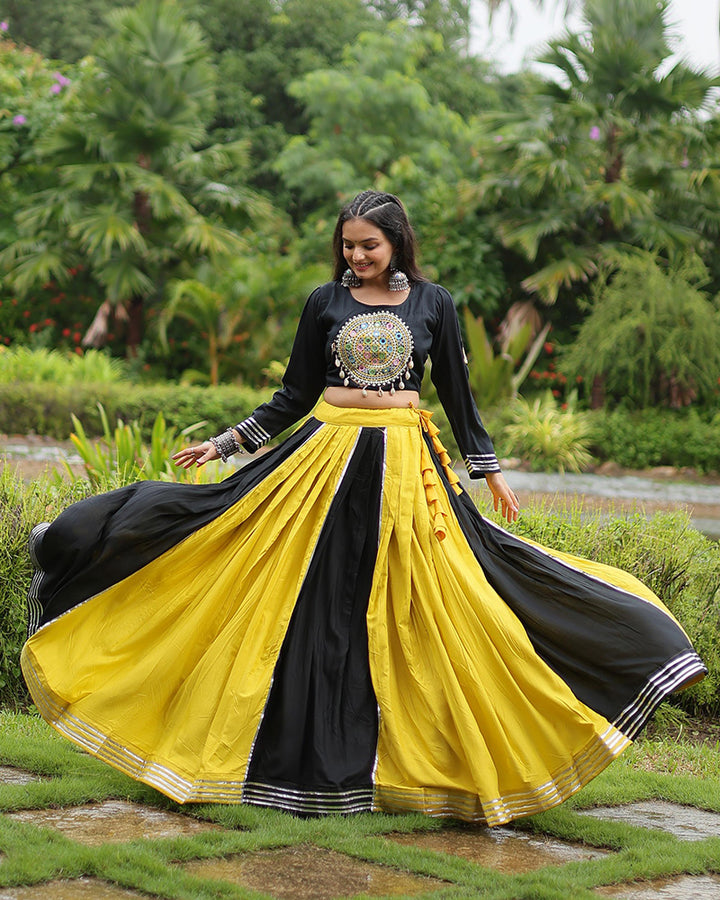 Navratri Wear Yellow And Black Color Rayon And Cotton Lehenga Choli