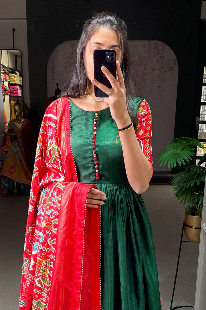 Green Color Patola Printed Dola Silk Fully Flair Gown