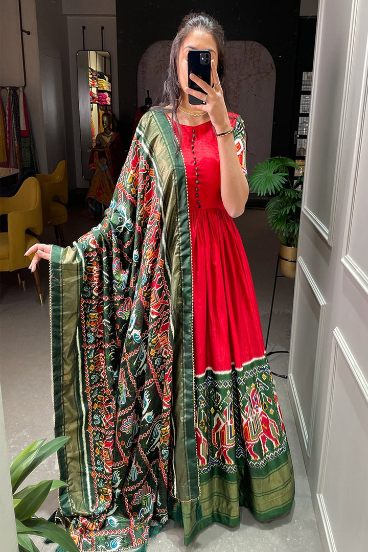 Red Color Patola Printed Dola Silk Fully Flair Gown
